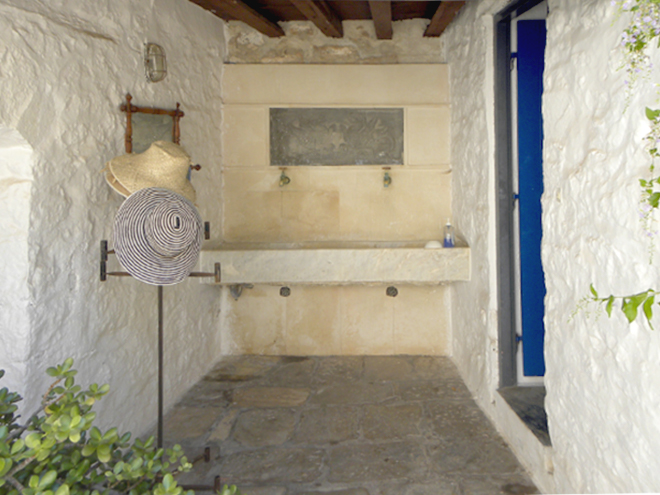 Outdoor washing basin and the second bathroom on the right hand side