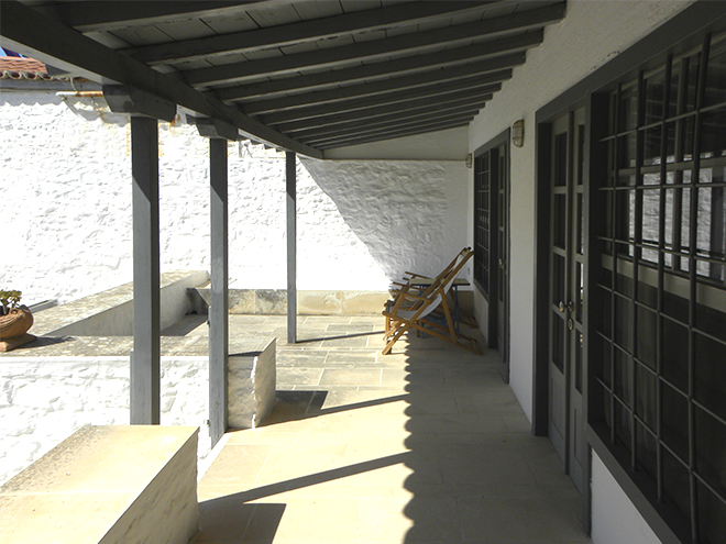 The first floor terrace and the windows and doors to the bedrooms